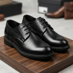 Classic black lace-up school shoes for boys with a polished synthetic leather upper, cushioned insole, and durable anti-slip sole, ideal for everyday school uniform wear.