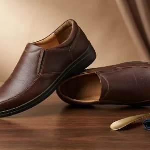 Men's brown slip-on formal leather office shoes with cushioned insole, durable anti-slip sole, and elegant design for business meetings, office wear, weddings, interviews, and formal occasions.