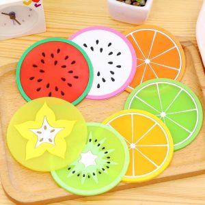 Set of four colorful silicone fruit slice coasters for cups and mugs, heat-resistant, waterproof, and non-slip table protection.